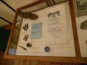 Objects extracted from the wreck, including General's shoe and blank Virtuti Militari certificates